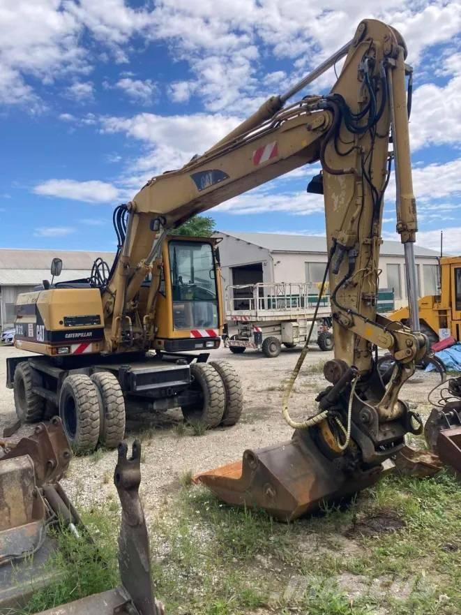 CAT M 312 Pelle sur pneus