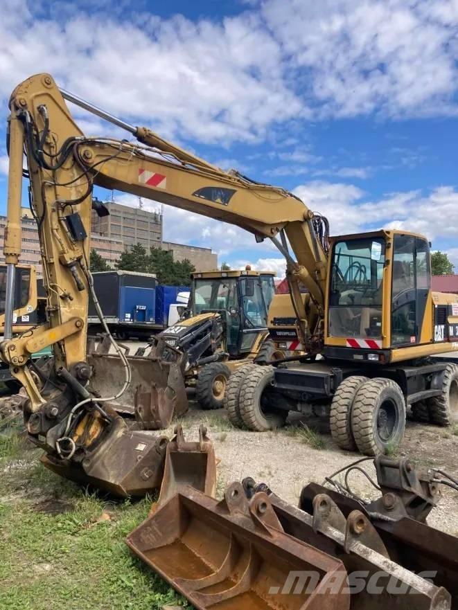 CAT M 312 Pelle sur pneus