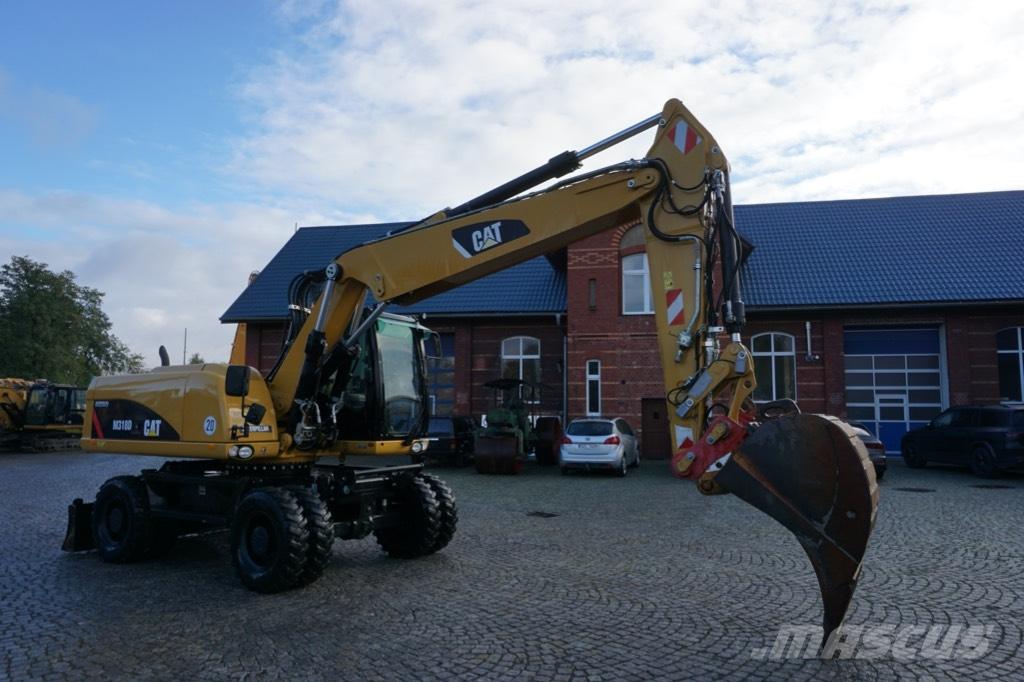 CAT M 318 D Pelle sur pneus