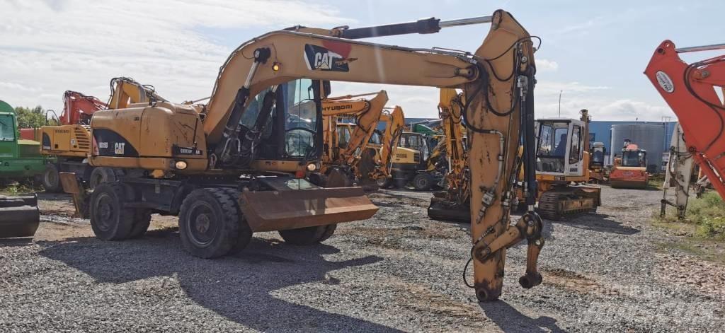 CAT M 315 D Pelle sur pneus