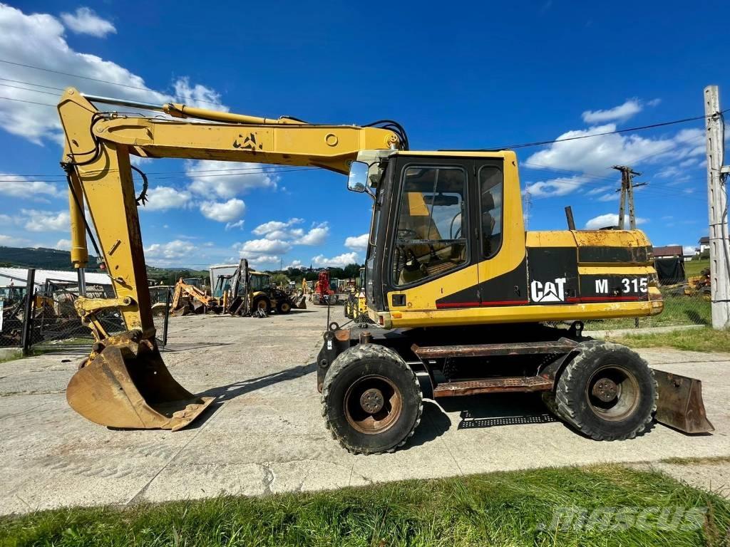 CAT M 315 Pelle sur pneus