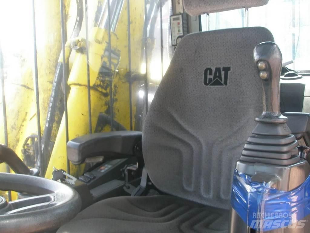 CAT M318F Pelle sur pneus