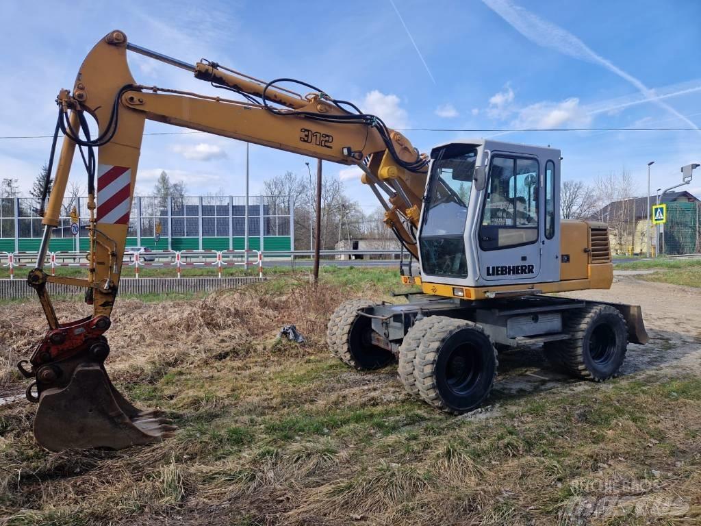 Liebherr 312 A Pelle sur pneus