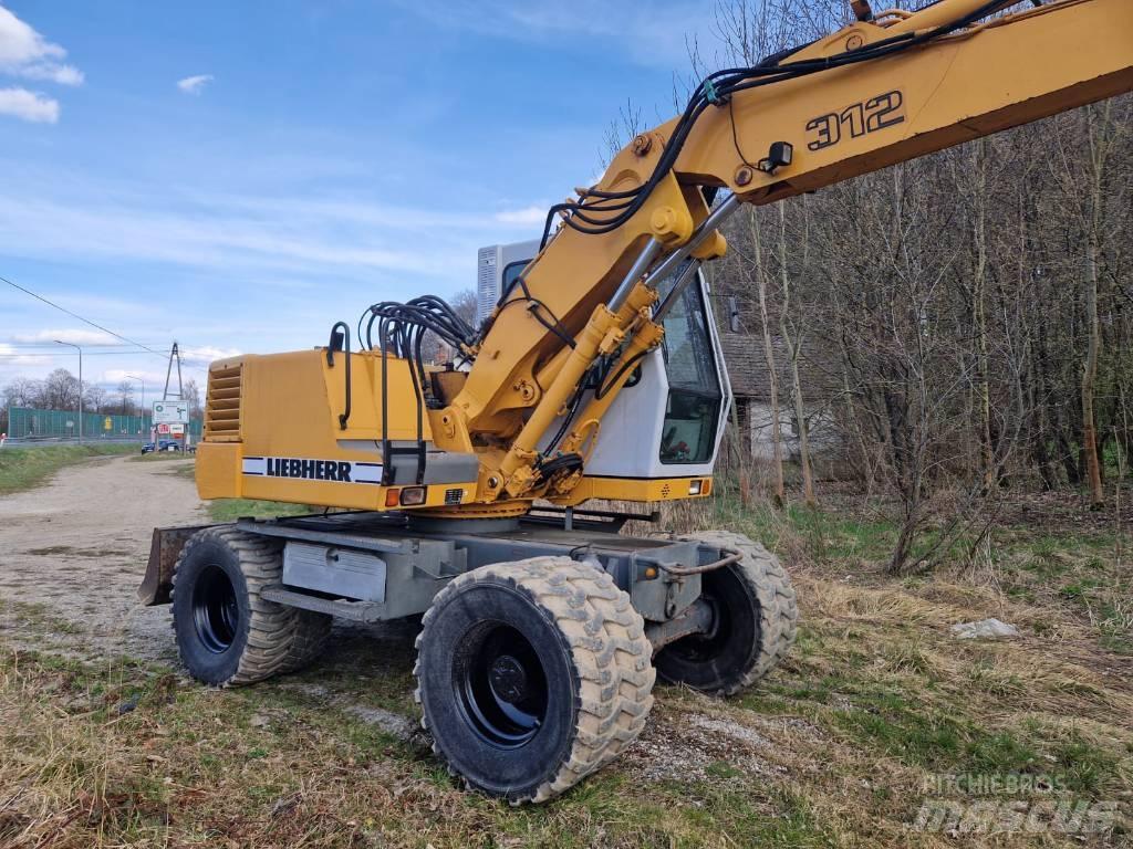 Liebherr 312 A Pelle sur pneus