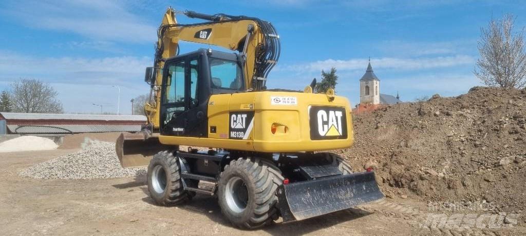 CAT M 313 D Pelle sur pneus