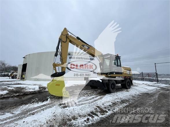 CAT M318D Pelle sur pneus