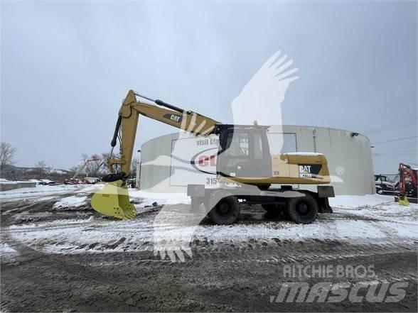 CAT M318D Pelle sur pneus
