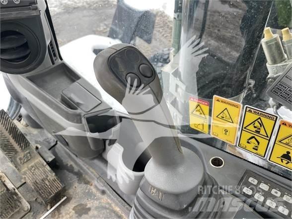 CAT M318D Pelle sur pneus
