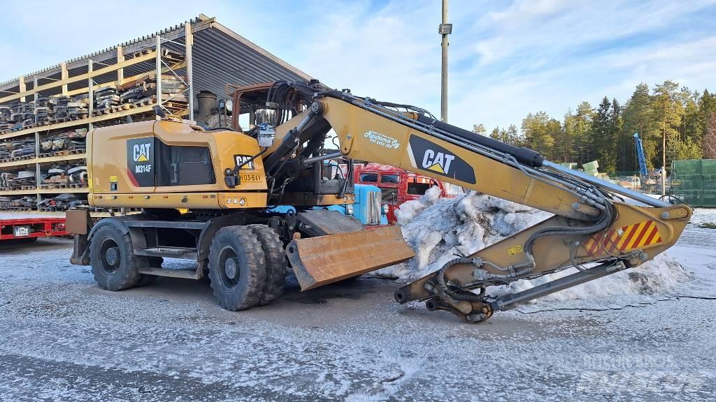 CAT M314F Pelle sur pneus
