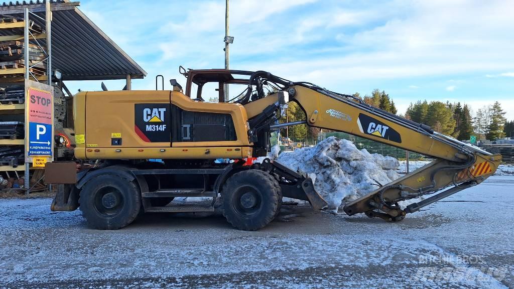 CAT M314F Pelle sur pneus