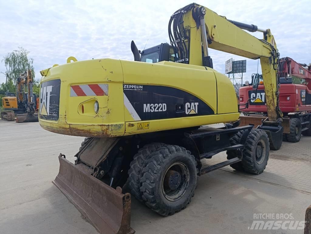 CAT M 322 D Pelle sur pneus