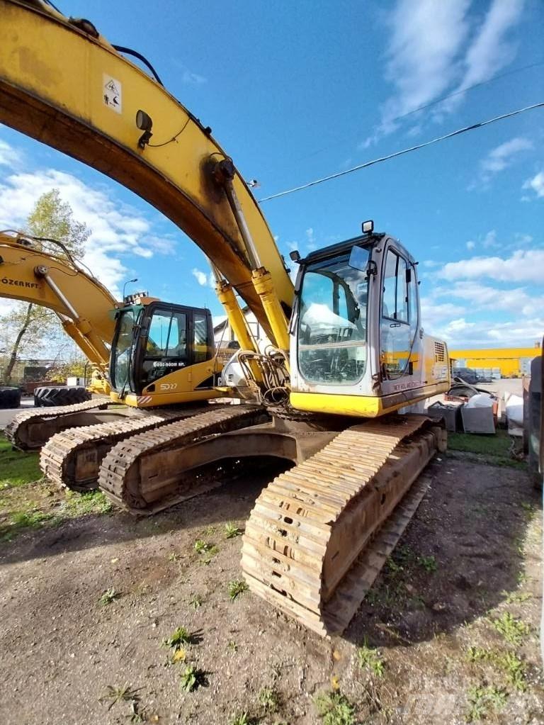 New Holland E 305 Pelle sur chenilles