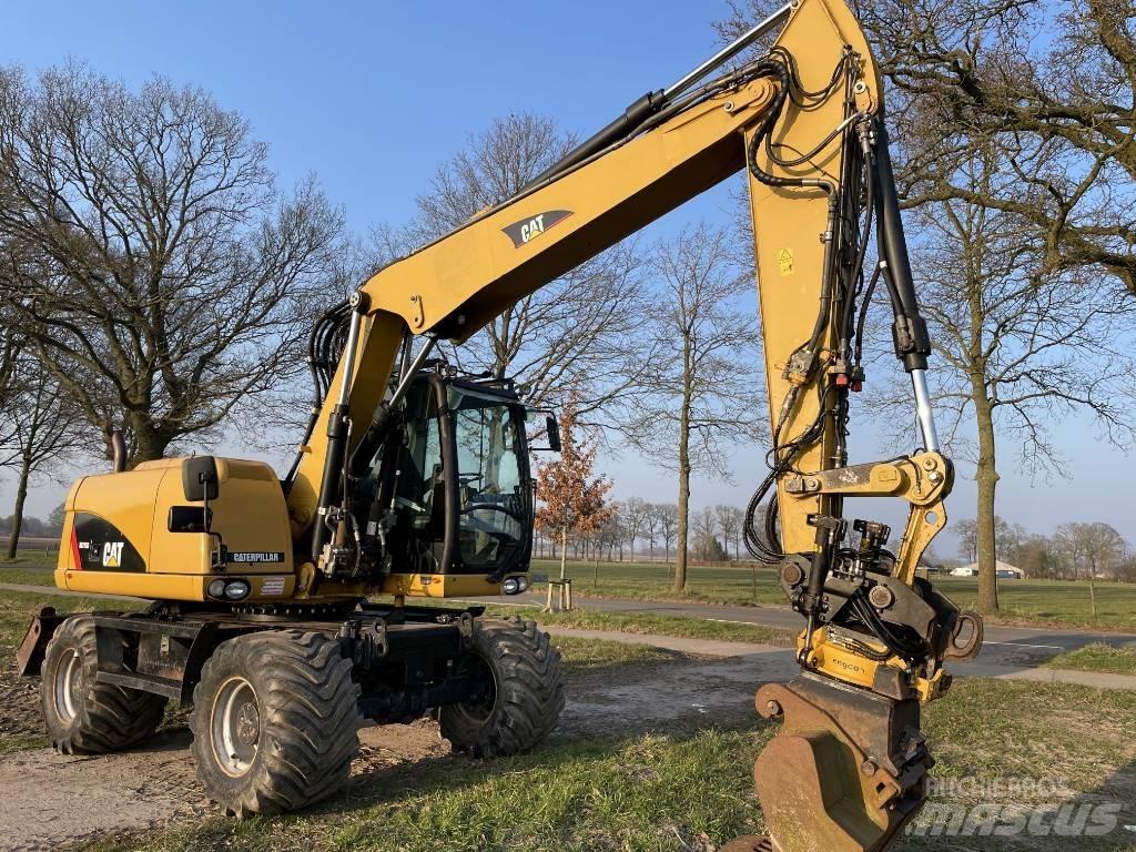 CAT M 313 D Pelle sur pneus