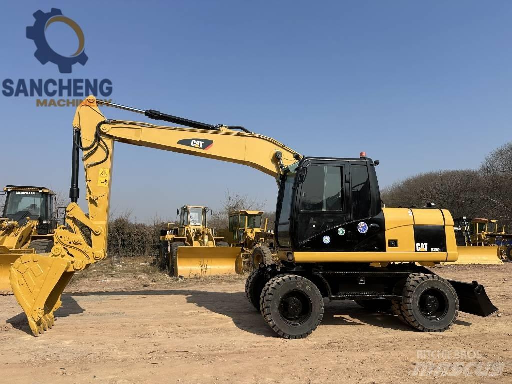 CAT M 320 D2 Pelle sur pneus