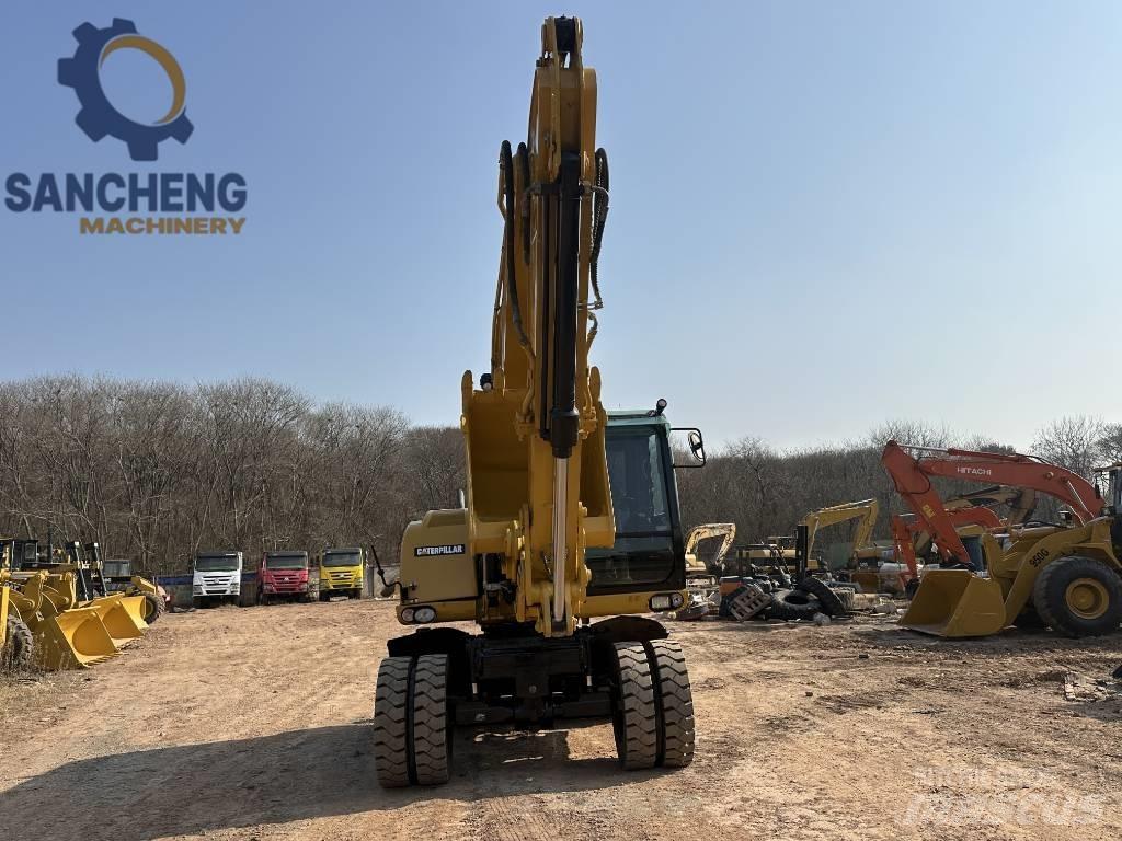 CAT M 320 D2 Pelle sur pneus
