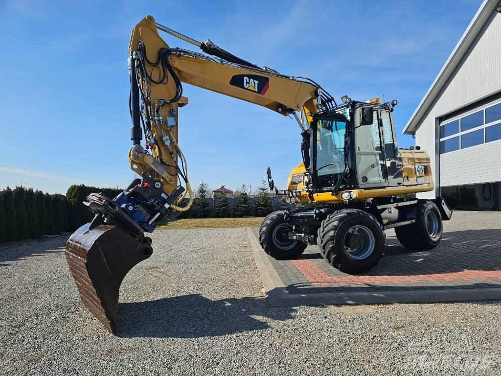 CAT 313 D Pelle sur pneus