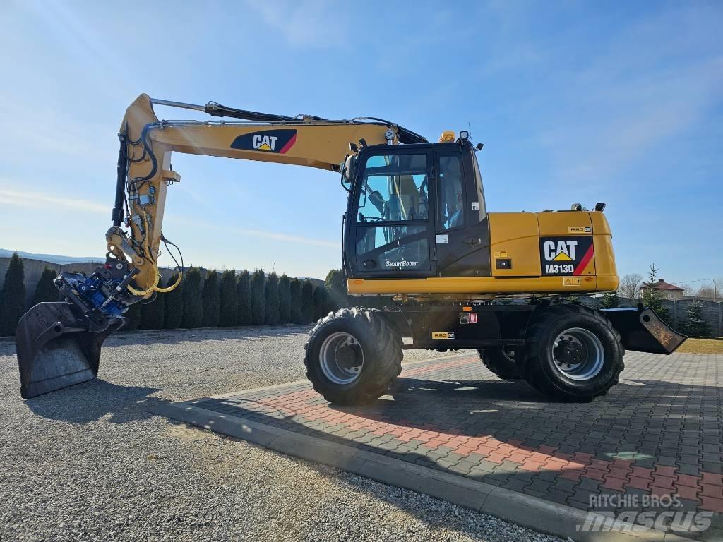 CAT 313 D Pelle sur pneus