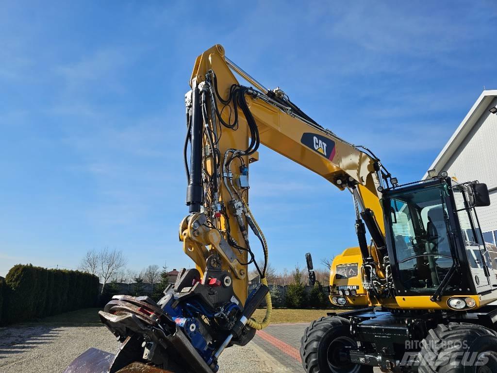 CAT 313 D Pelle sur pneus