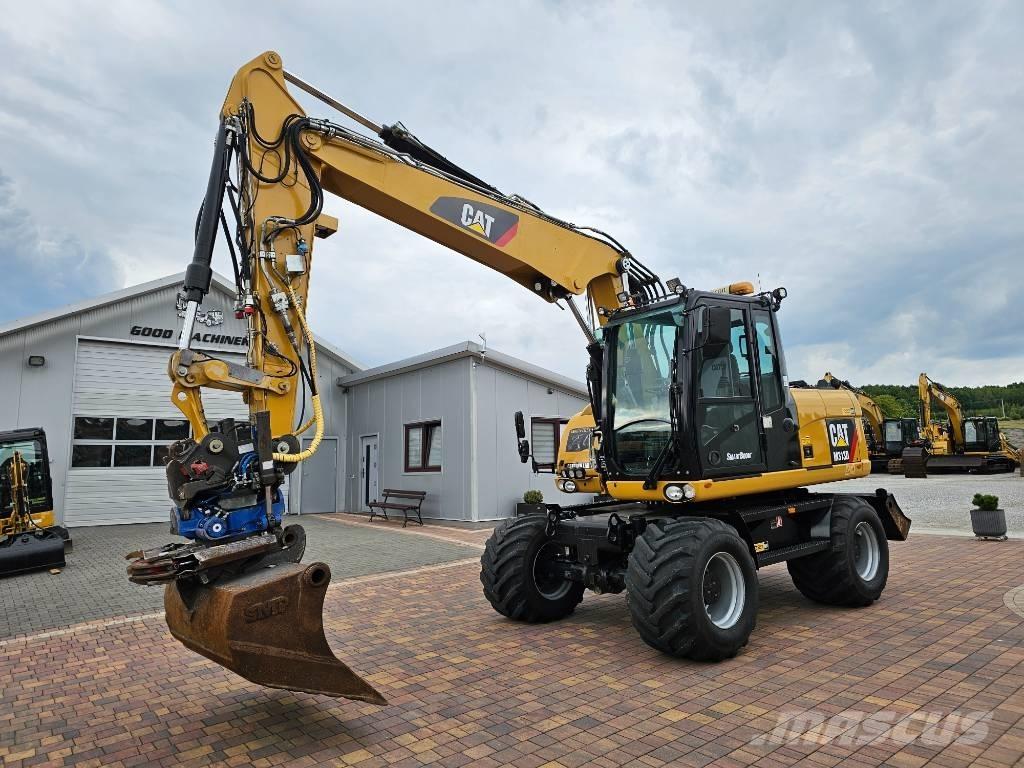 CAT M 313 D Pelle sur pneus