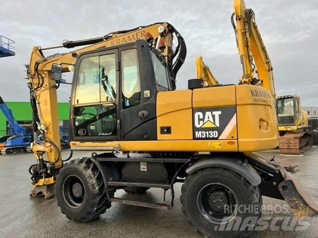 CAT M 313 D Pelle sur pneus