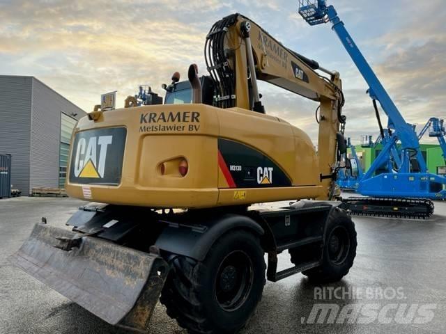 CAT M 313 D Pelle sur pneus
