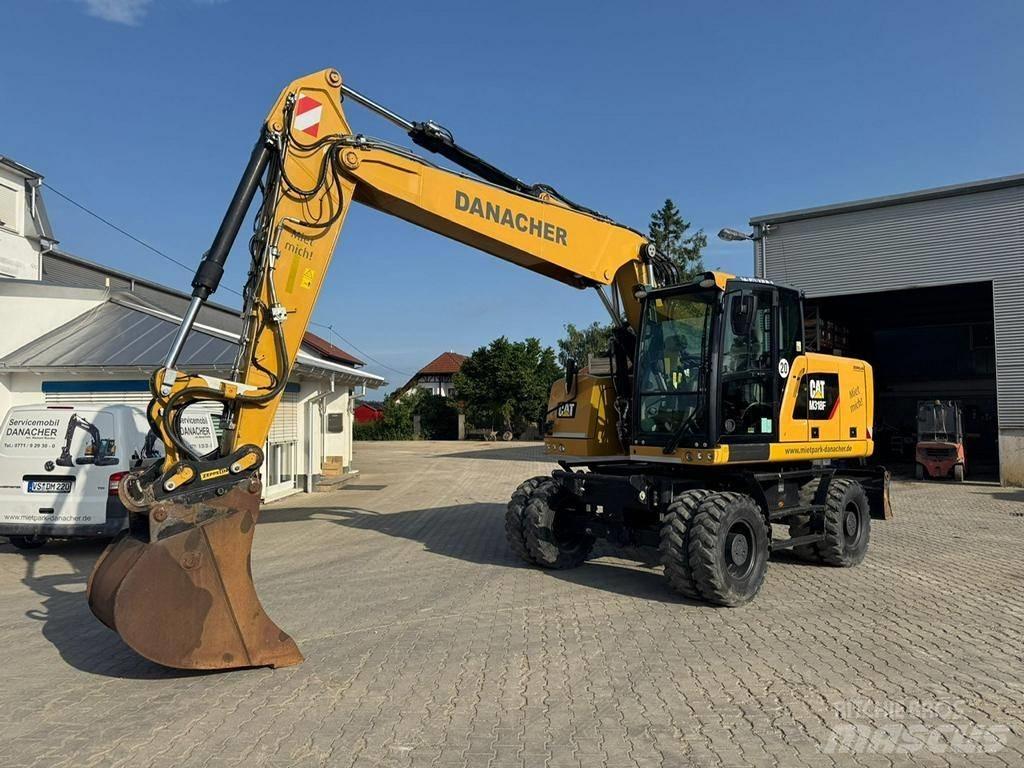 CAT M 318 F Pelle sur pneus