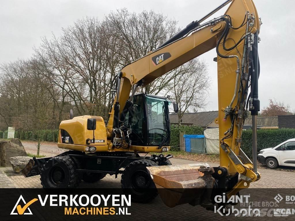 CAT M313D Pelle sur pneus