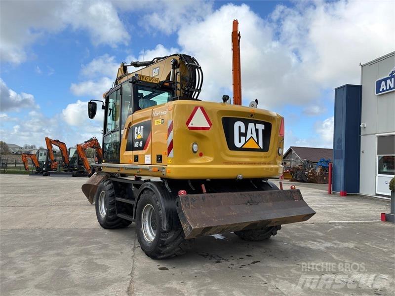 CAT M314F Pelle sur pneus
