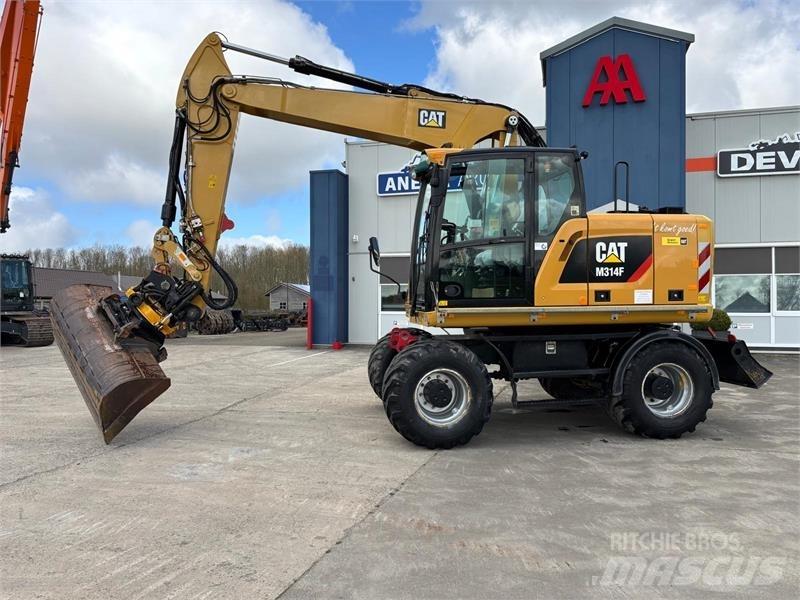 CAT M314F Pelle sur pneus