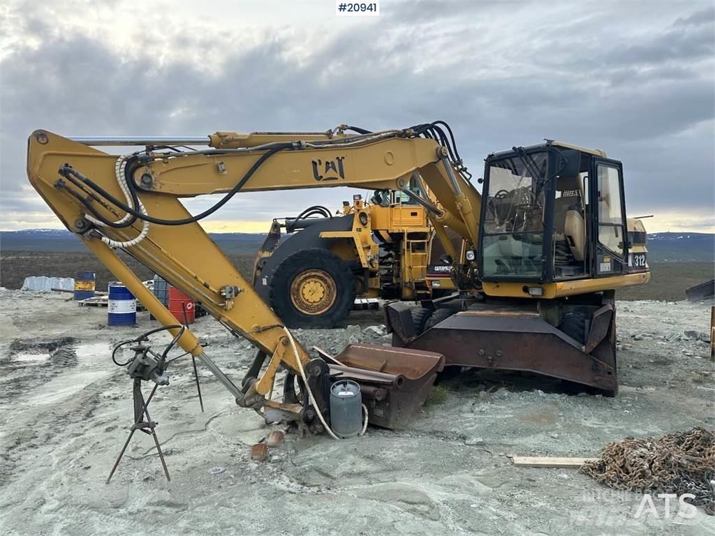 CAT 312 Pelle sur pneus