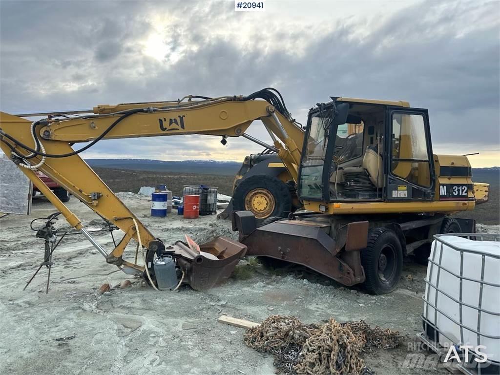 CAT 312 Pelle sur pneus
