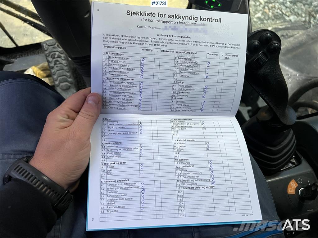 CAT M318F Pelle sur pneus