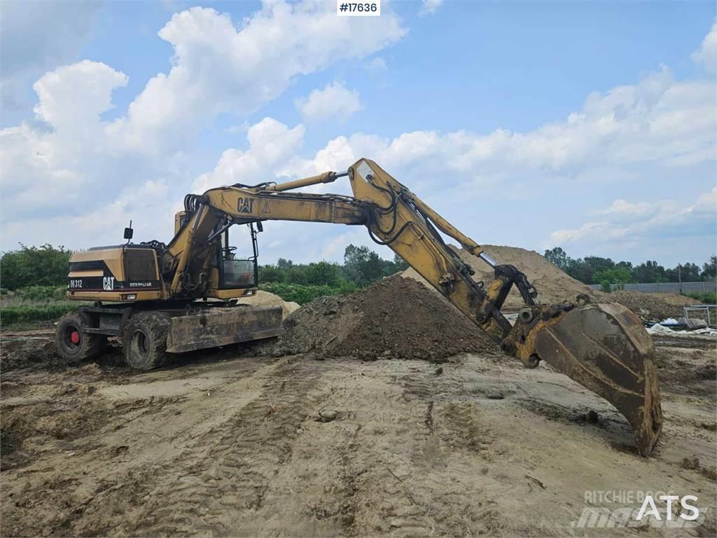 CAT M312 Pelle sur pneus