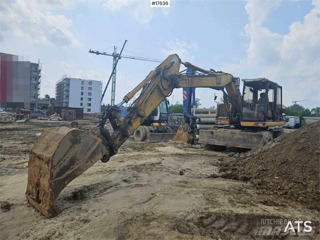 CAT M312 Pelle sur pneus