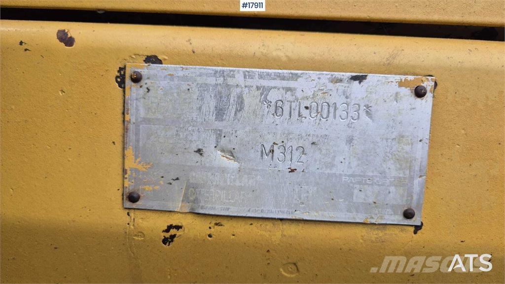 CAT M312 Pelle sur pneus