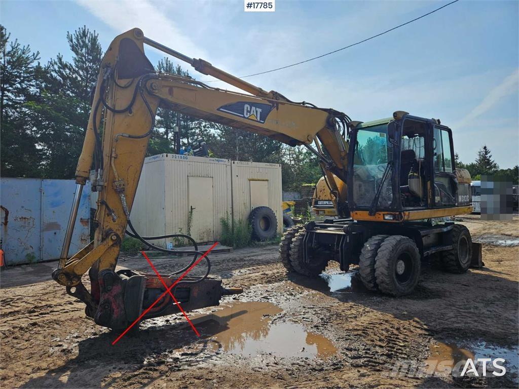 CAT M313 C Pelle sur pneus