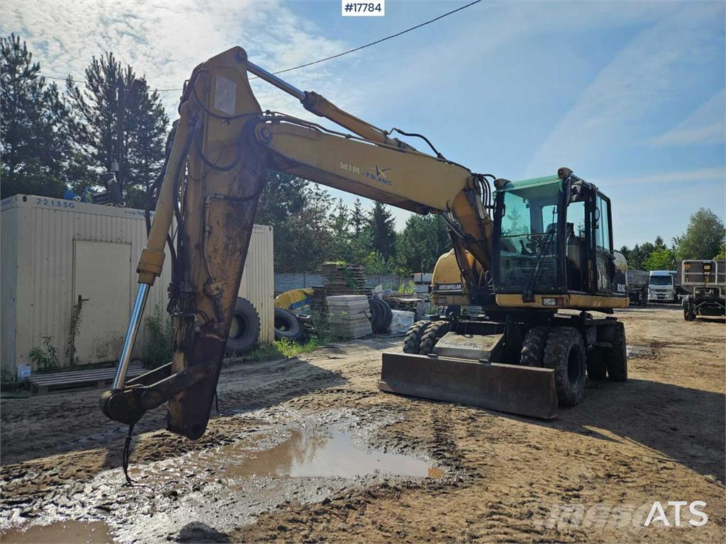 CAT M316C Pelle sur pneus