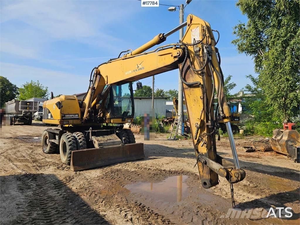 CAT M316C Pelle sur pneus
