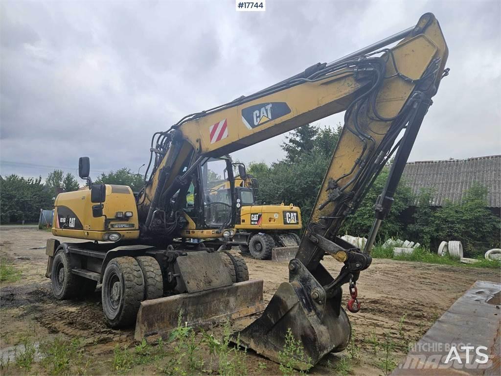 CAT M316D Pelle sur pneus
