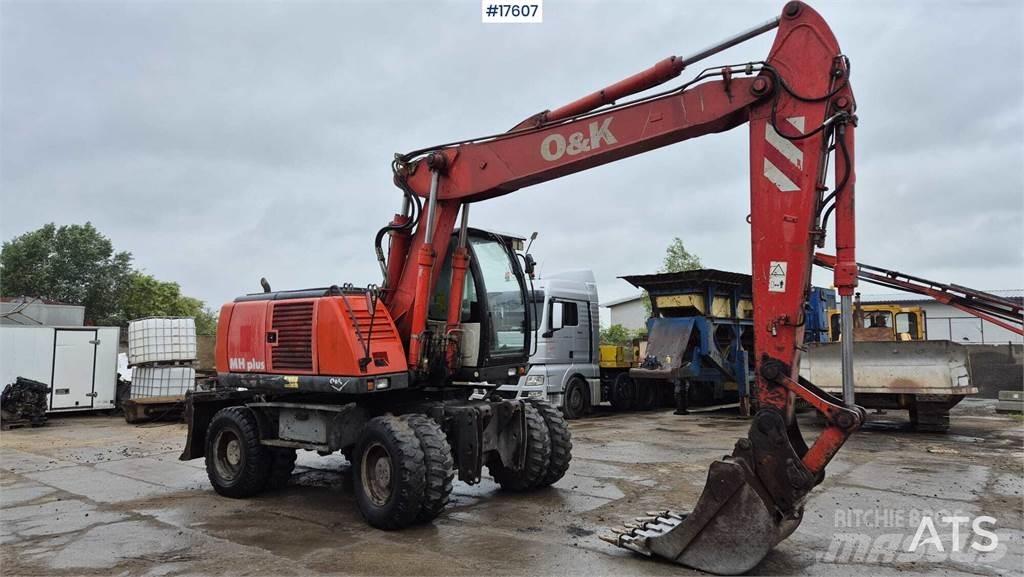 O&K MH PLUS Pelle sur pneus