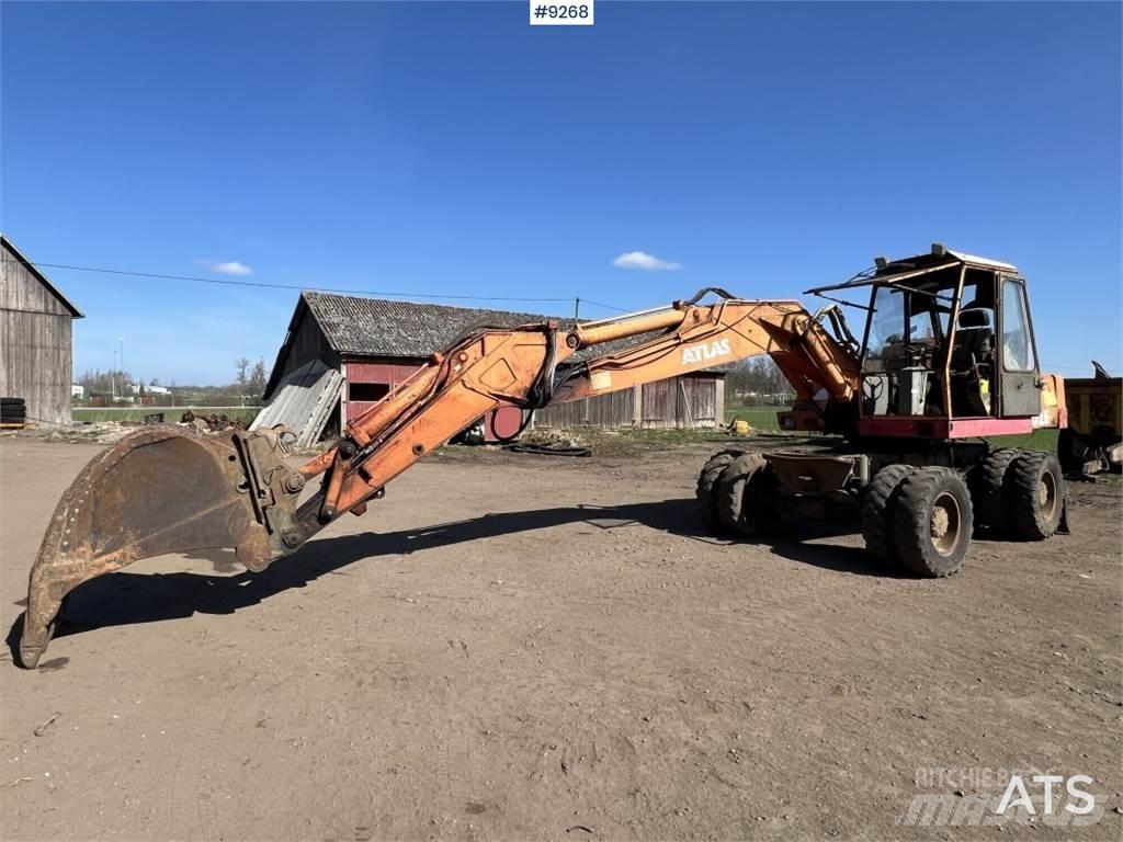 Atlas 1302E Pelle sur pneus