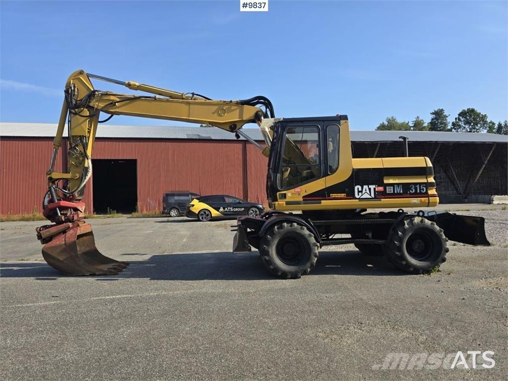 CAT M315 Pelle sur pneus