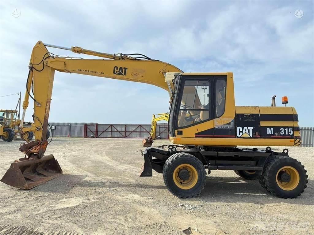 CAT M 315 Pelle sur pneus