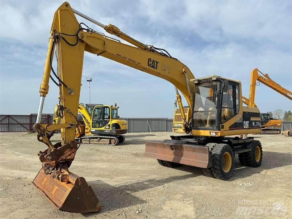 CAT M 315 Pelle sur pneus