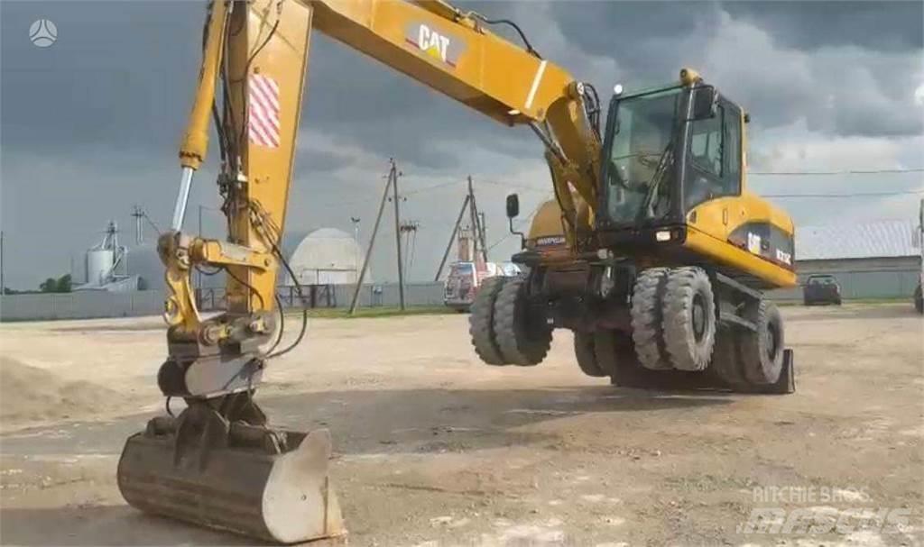 CAT M315C Pelle sur pneus
