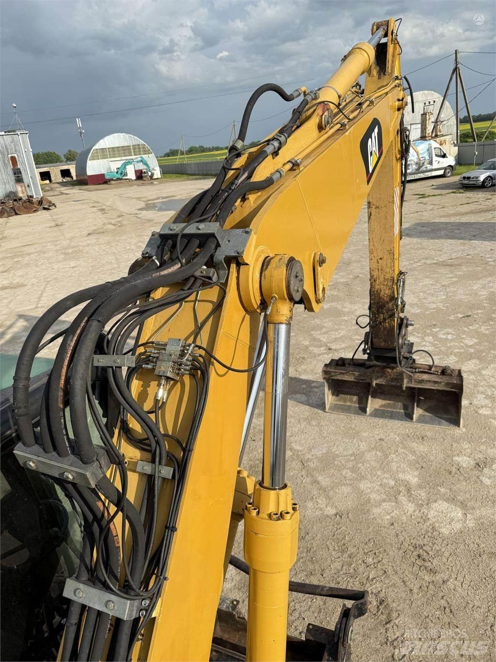 CAT M315C Pelle sur pneus