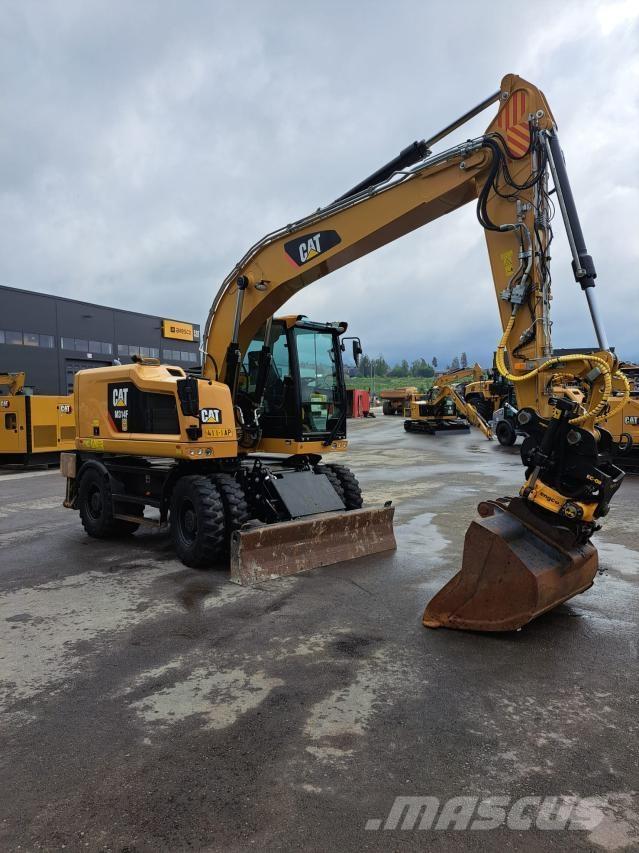 CAT M314F Pelle sur pneus