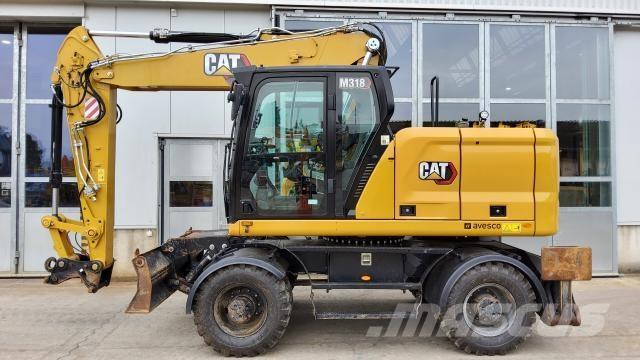 CAT M318-07E Pelle sur pneus