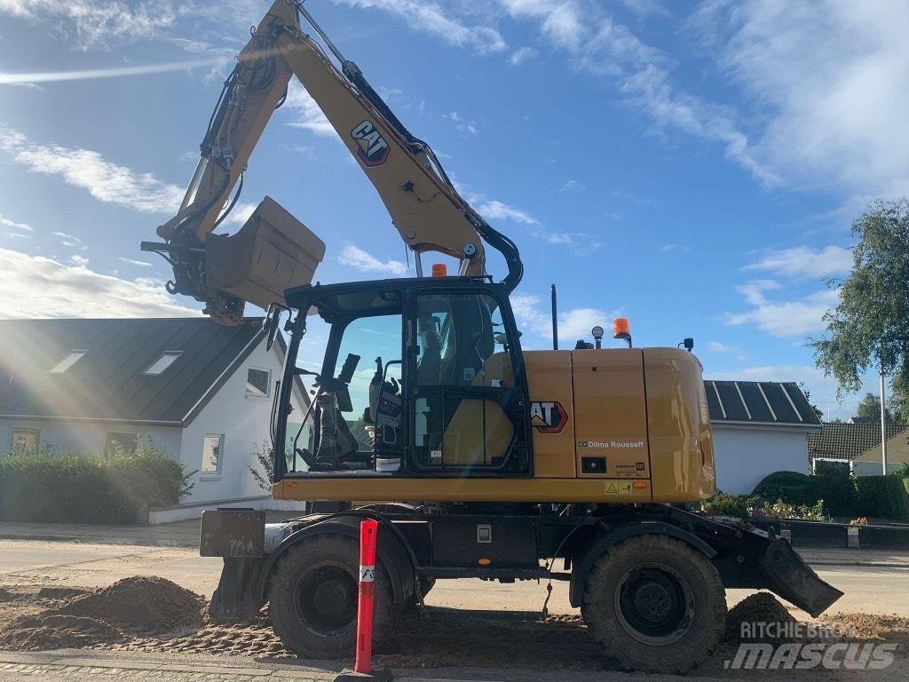 CAT M314 Pelle sur pneus