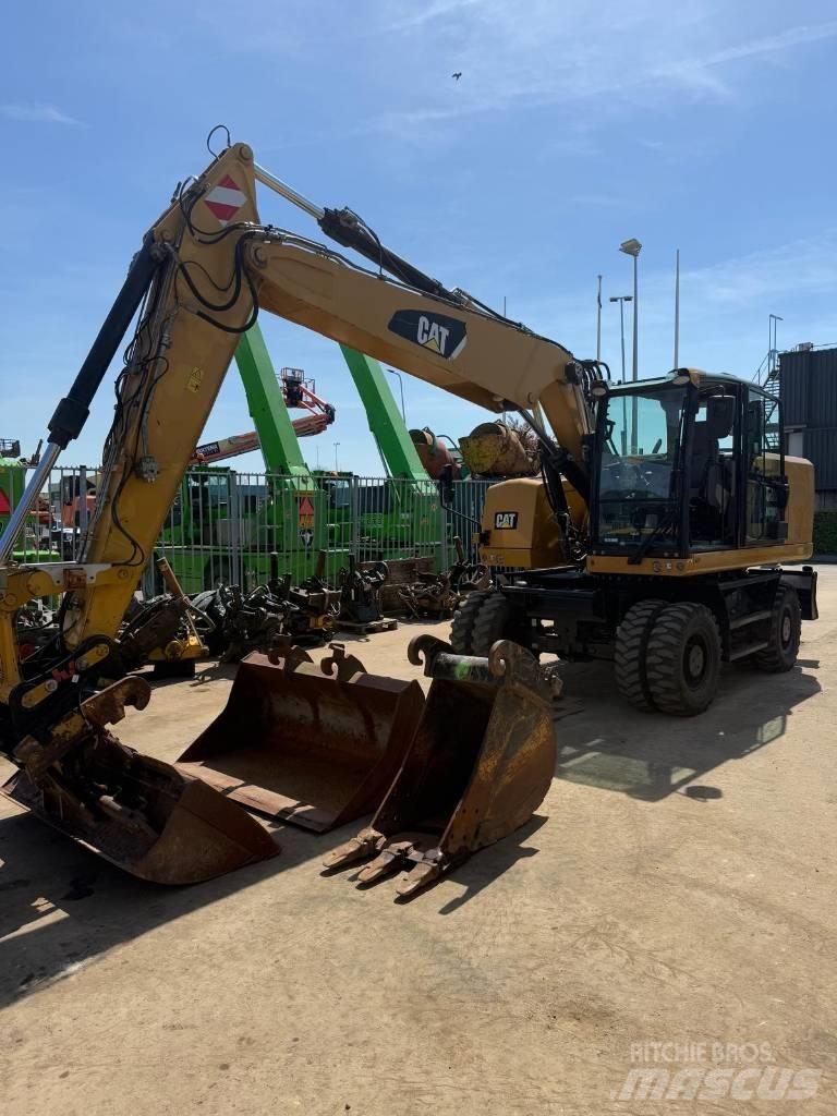 CAT M 318 F Pelle sur pneus